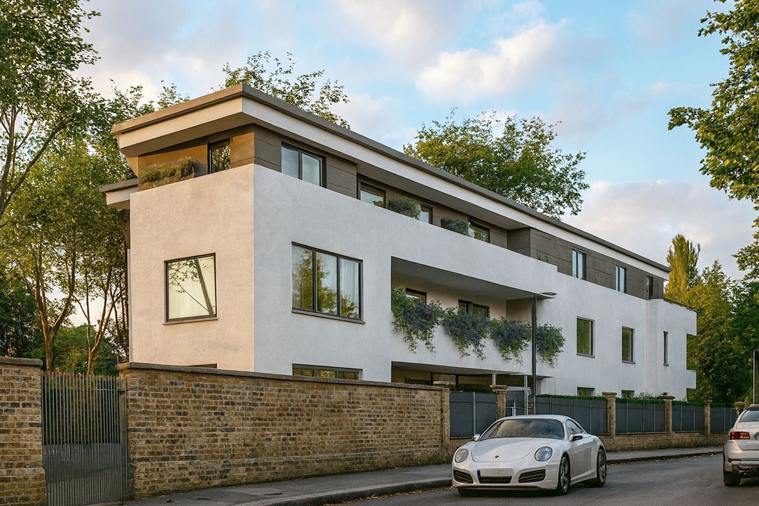 Modern white two-story house with a car parked outside on a quiet street