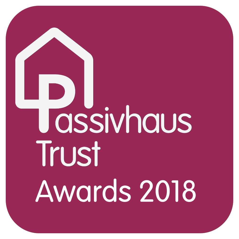 Passivhaus Trust Awards 2018 logo on maroon background with white house icon