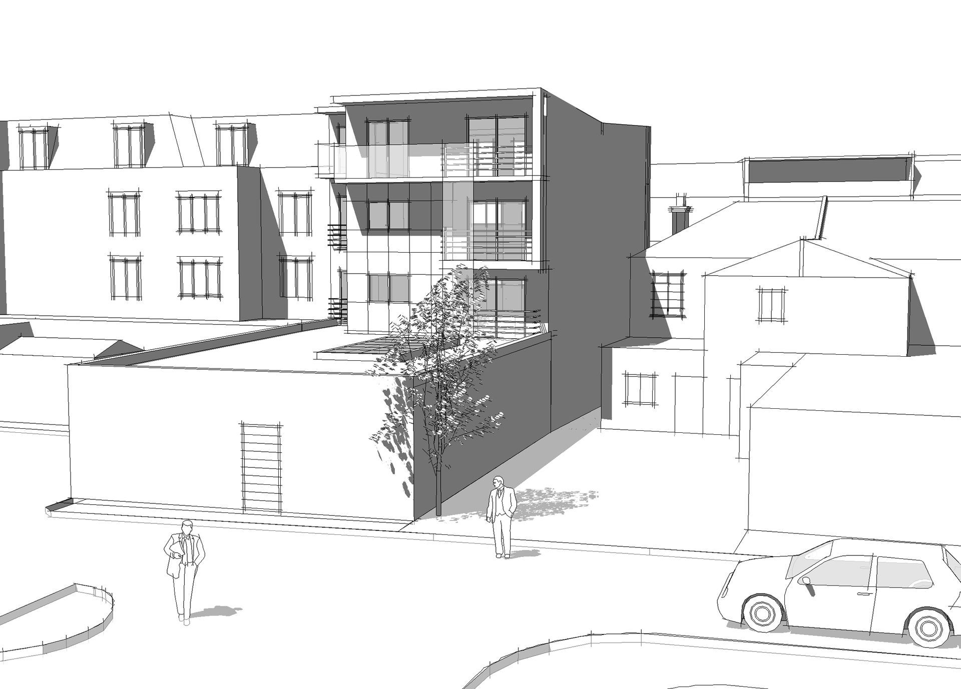 Street view of modern apartment buildings and houses with parked cars in bright daylight