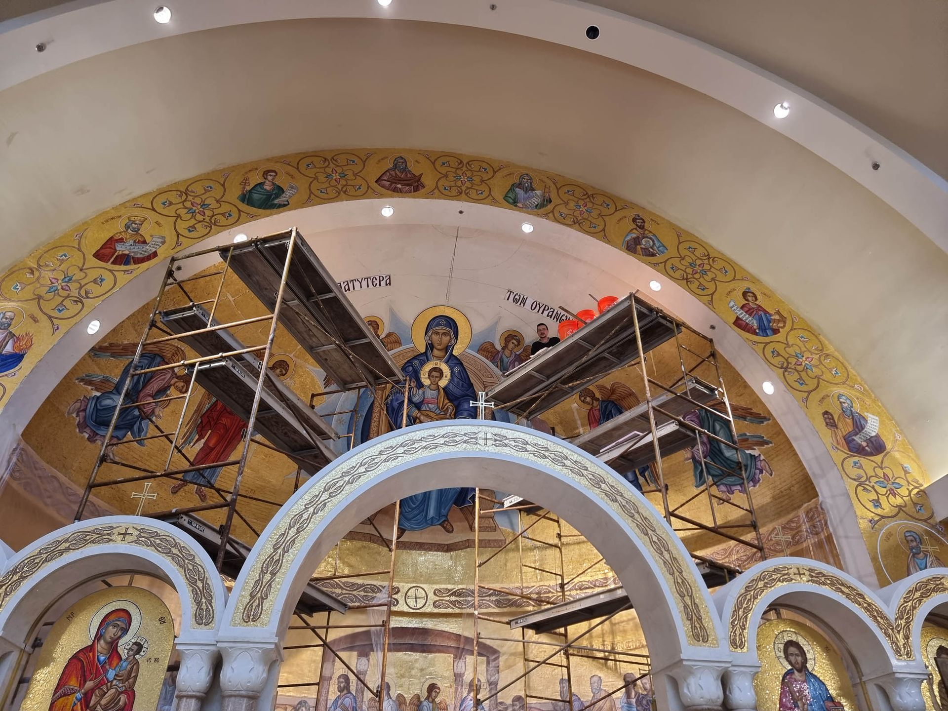 Mosaic Platytera installation at St. Demetrios Weston with scaffolding and artisan, Orthodox-Byzantine sacred art project.