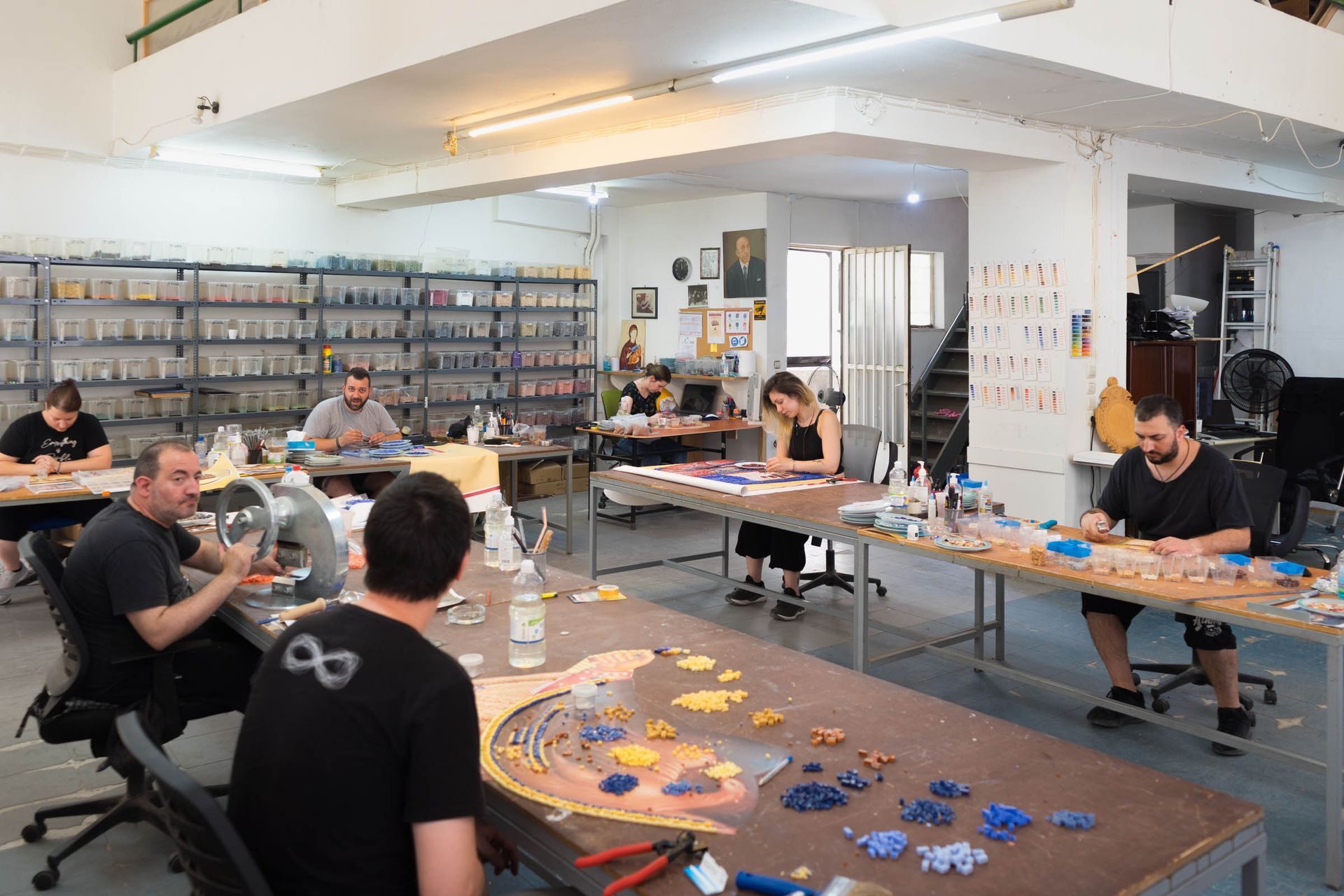 Byzantine Artworks studio artisans handcut and lay mosaic tesserae in our workshop in Greece during church mosaic fabrication