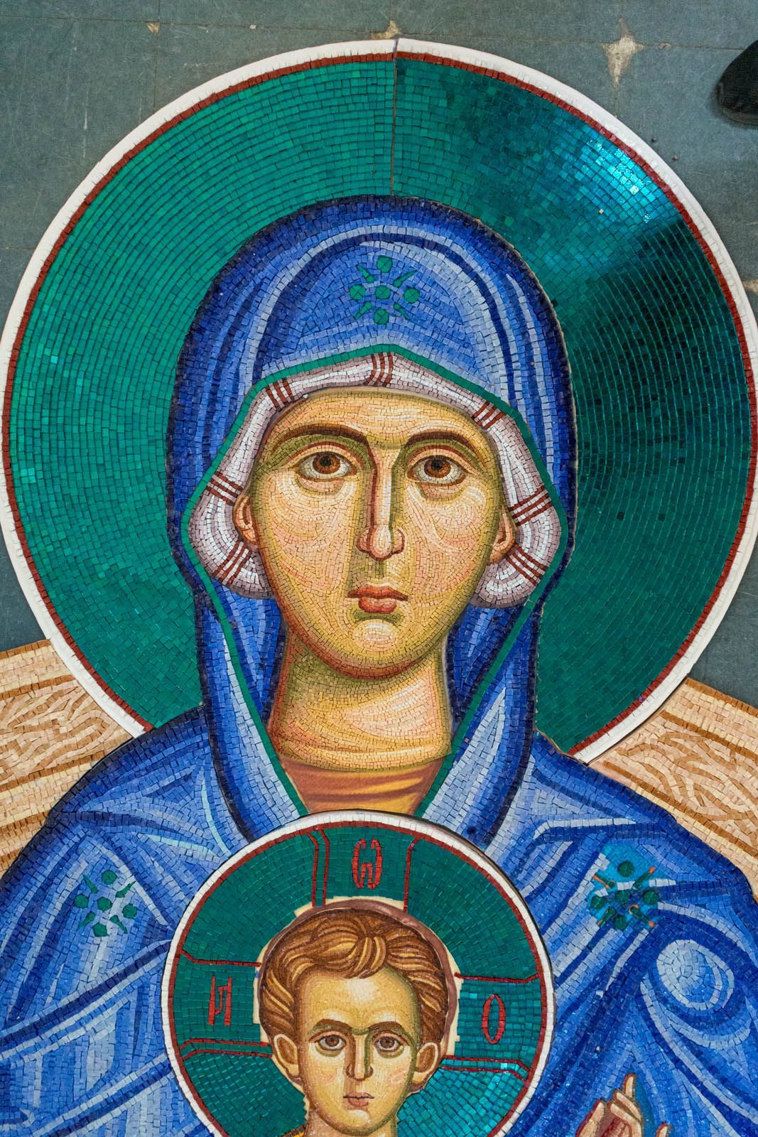 Detail of reverse-method Byzantine mosaic of Theotokos & Christ Child, hand-cut tesserae in studio before church installation