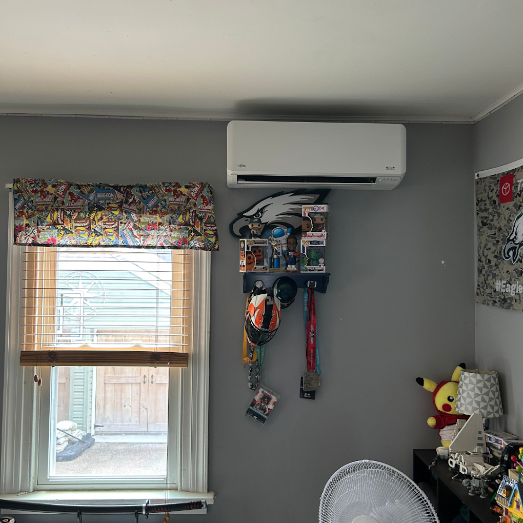 A bedroom with a window , a fan , and a ceiling fan.