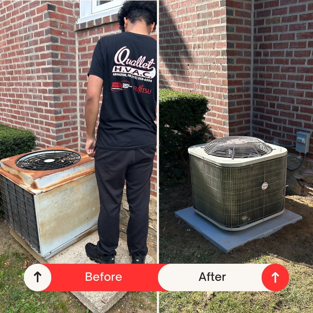 A man is standing next to an air conditioner in front of a brick building.