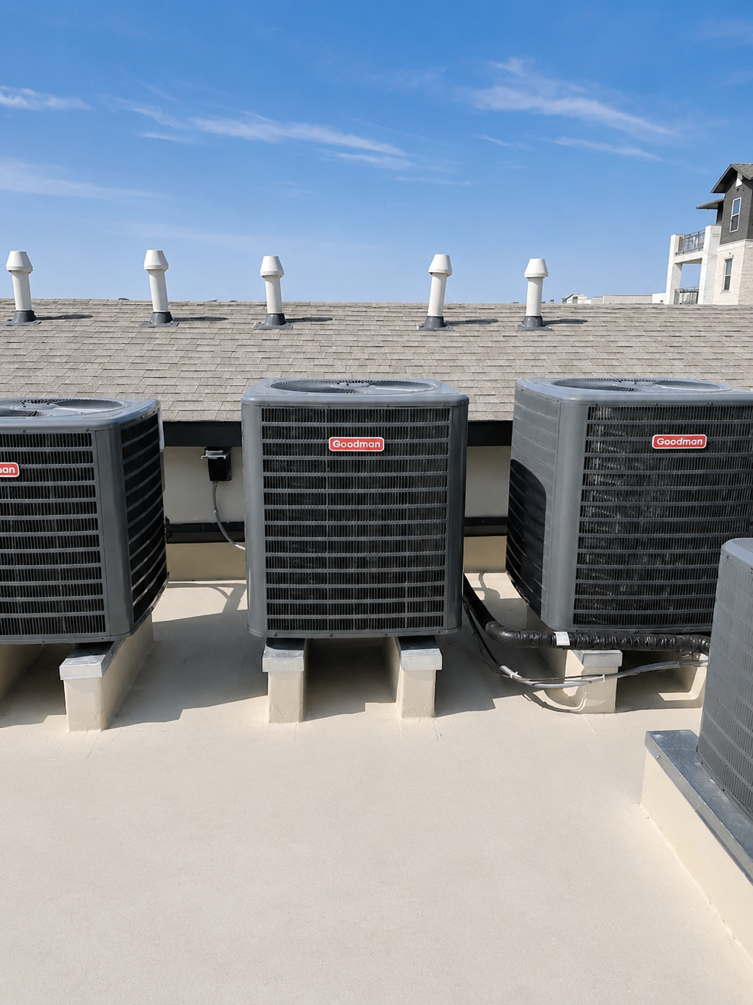 Rooftop air conditioning unit with tools, Coleman brand, sunny day.