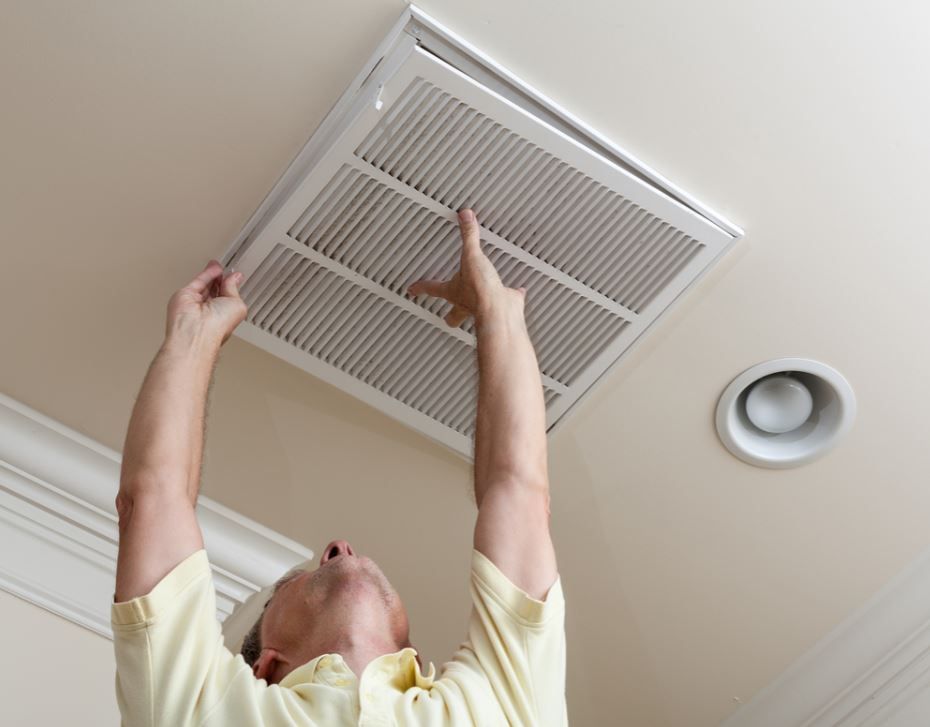 HVAC technician performing a Delray Beach AC installation and ductwork inspection