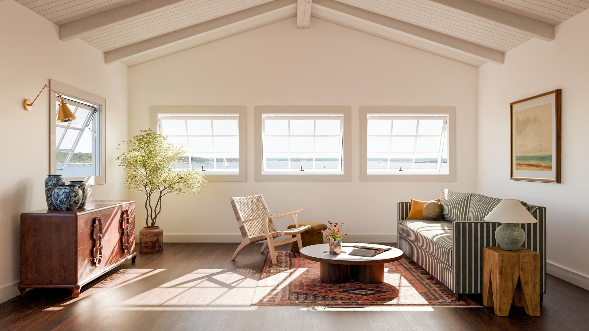 Bright living room with three windows, sofa, chairs, coffee table, and warm wood accents