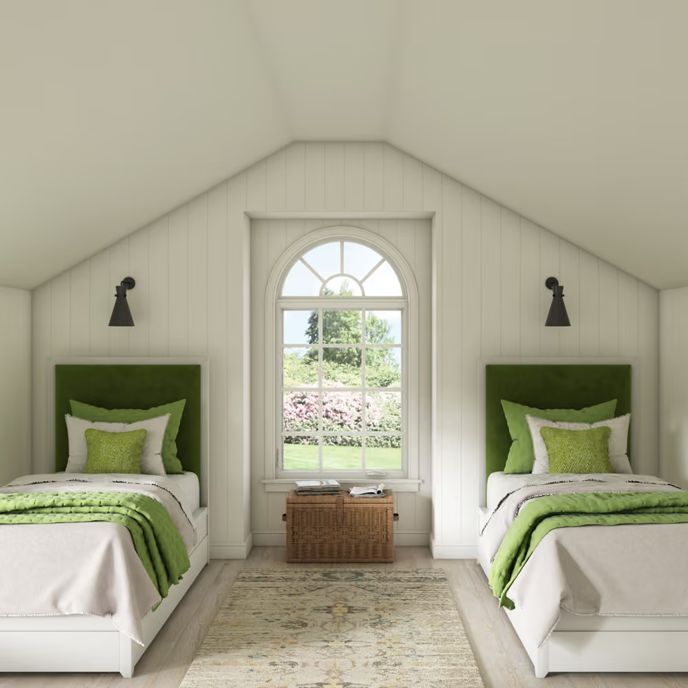Bright attic bedroom with twin beds, green accents, arched window, and woven bench at center.