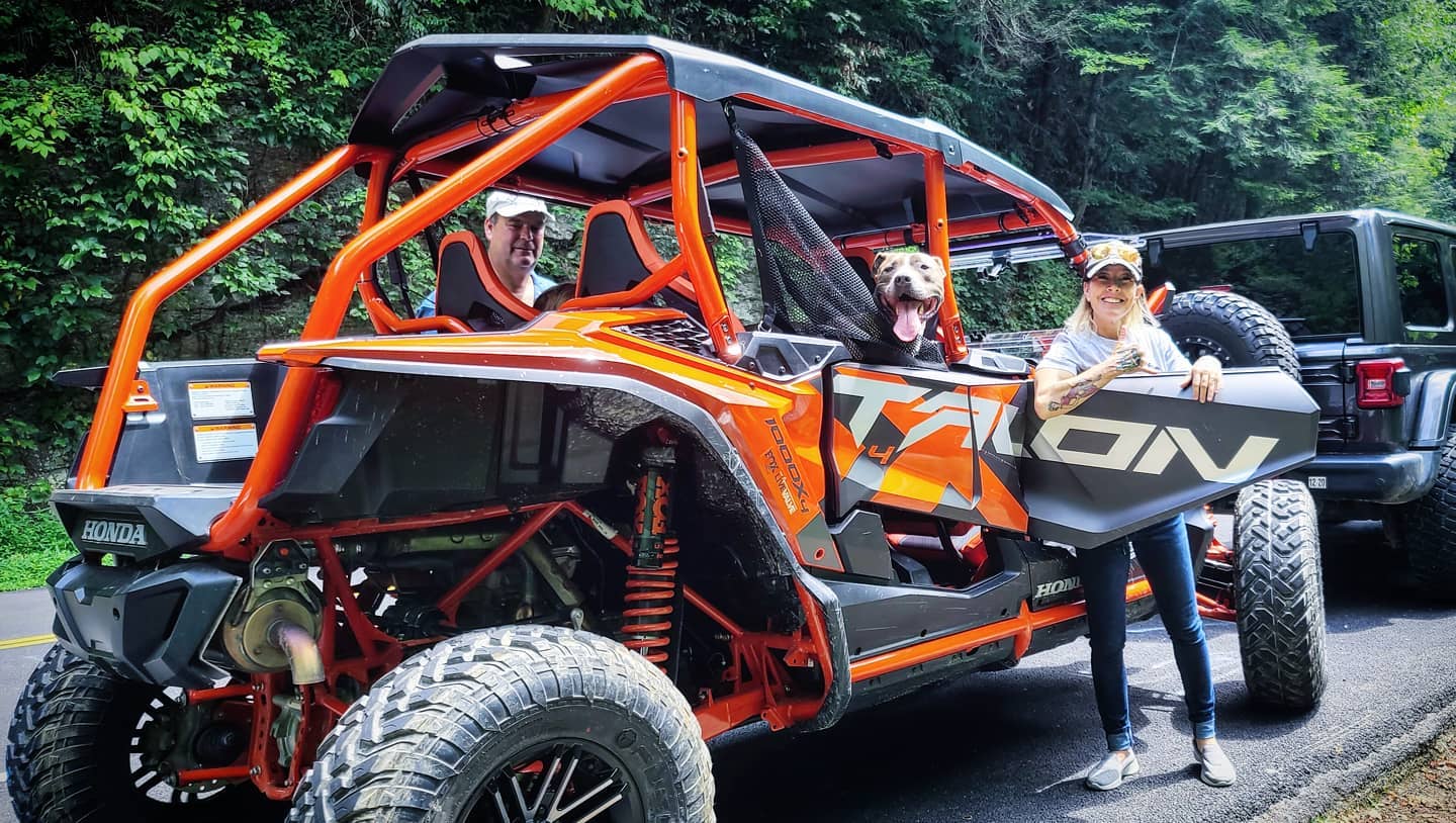 Couple enjoying the Honda Talon with their dog