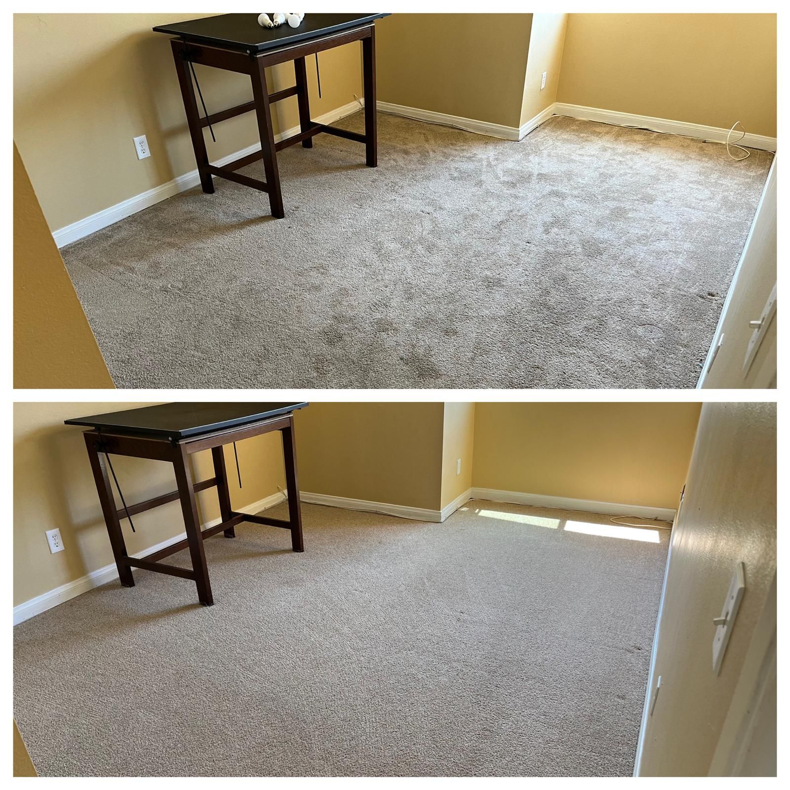 Small beige carpeted room with a dark wood table and a window with blinds.