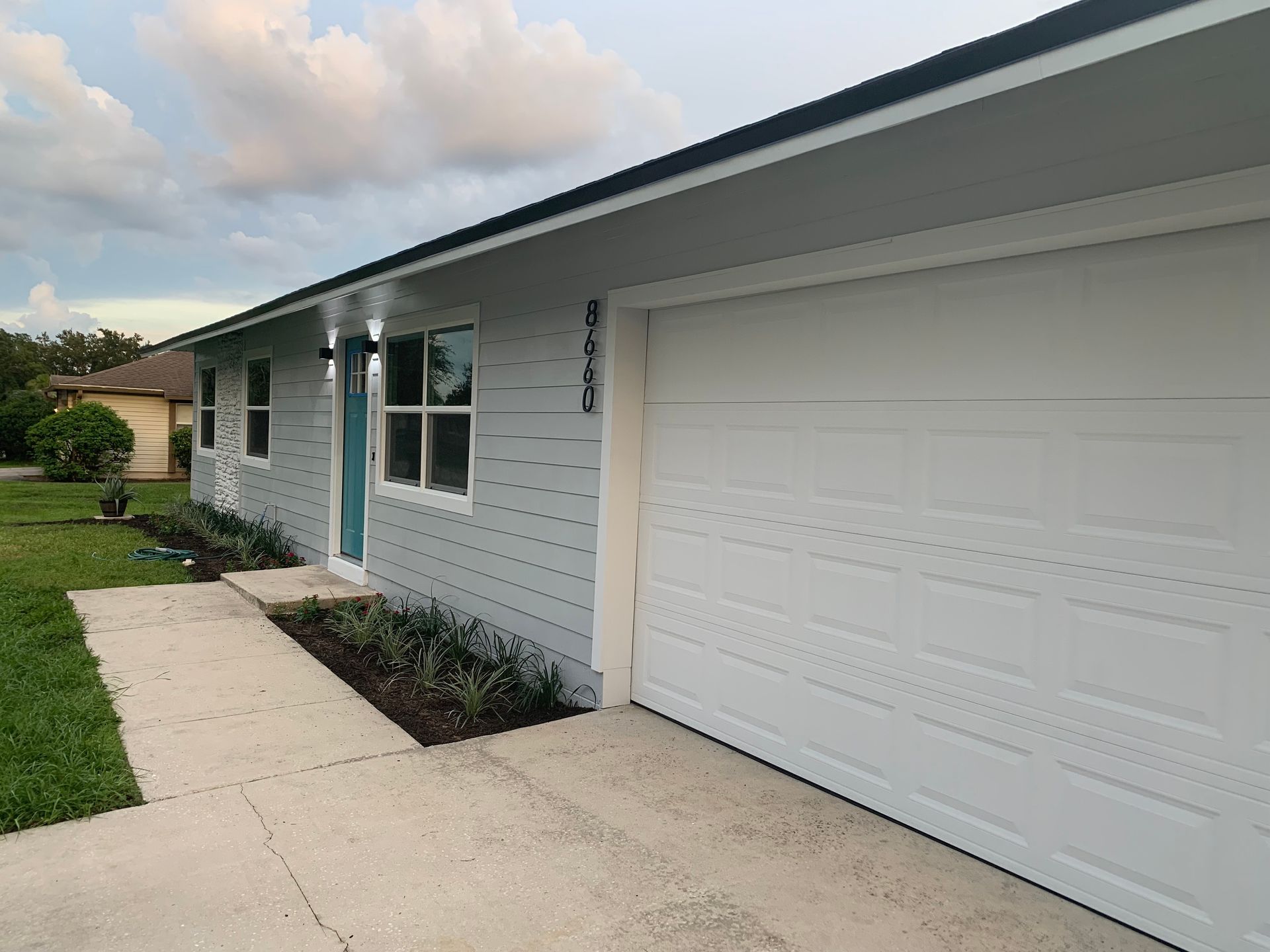 a white garage door with the number 8660 on it