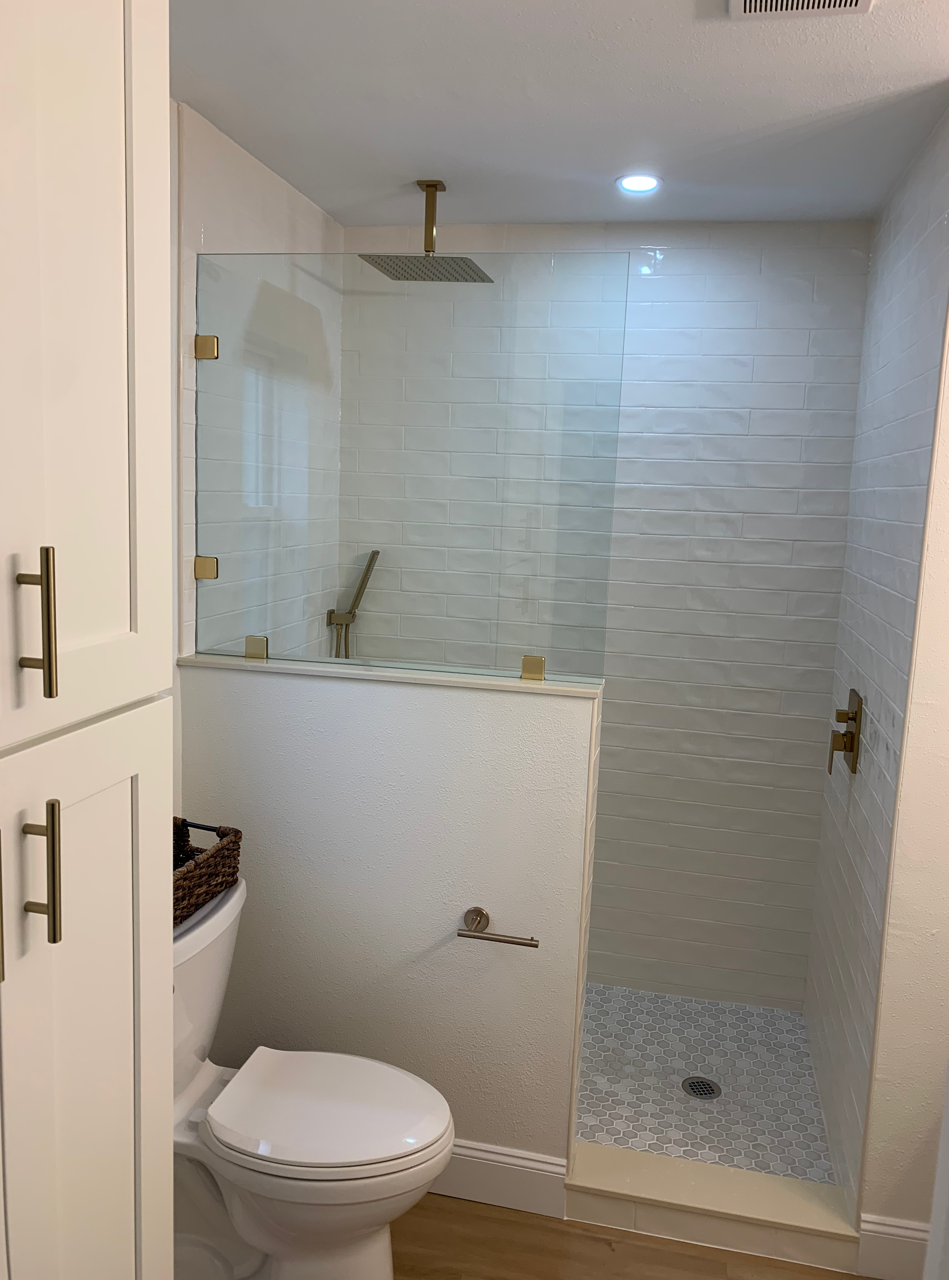 A bathroom with a bathtub and a walk in shower.