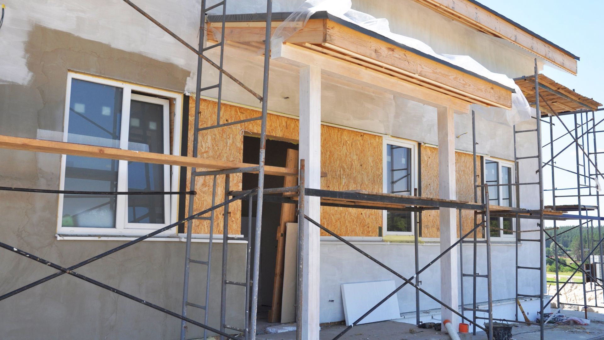 A house is being built with scaffolding around it.
