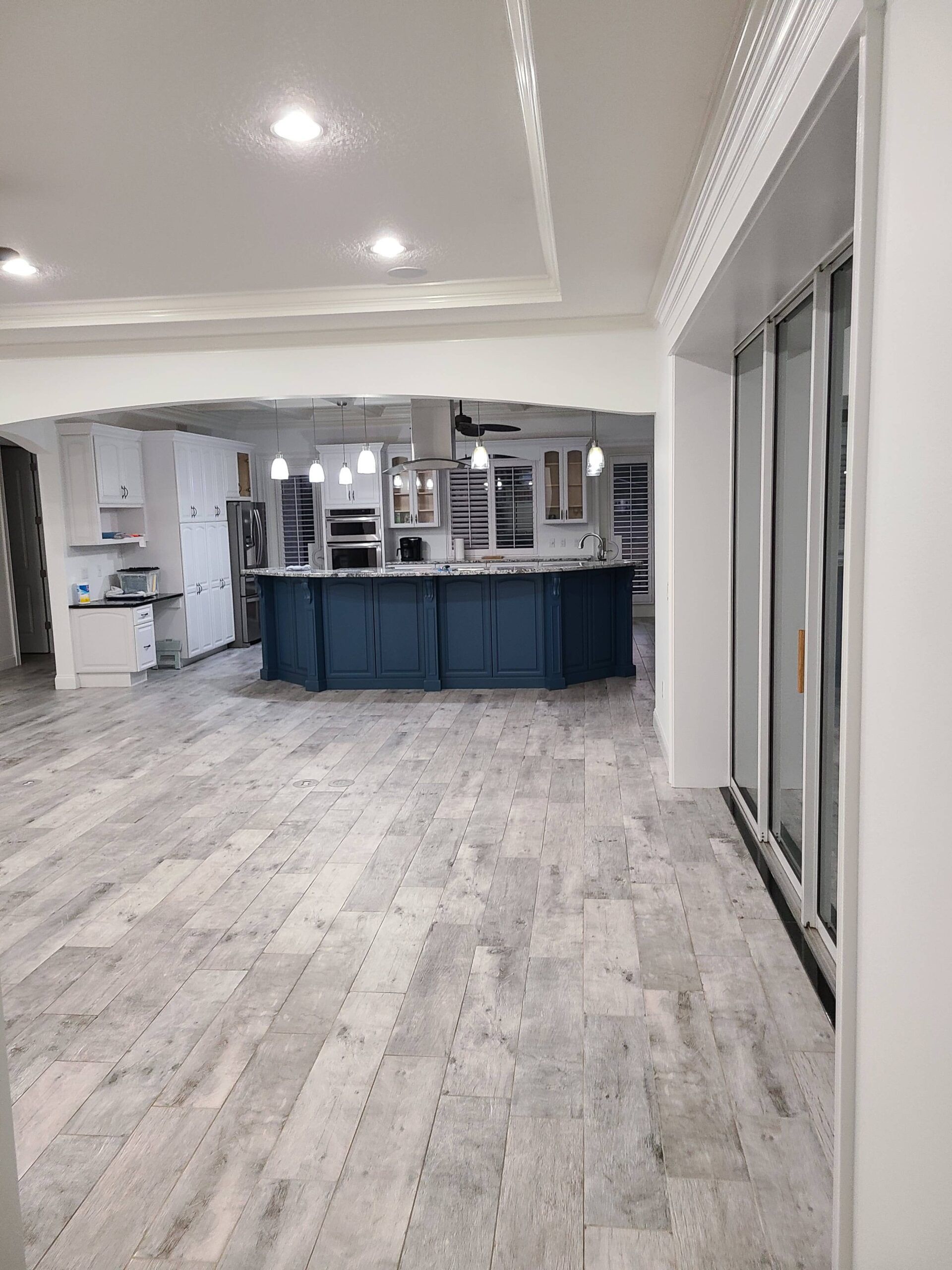 A kitchen with a large island in the middle of the room.