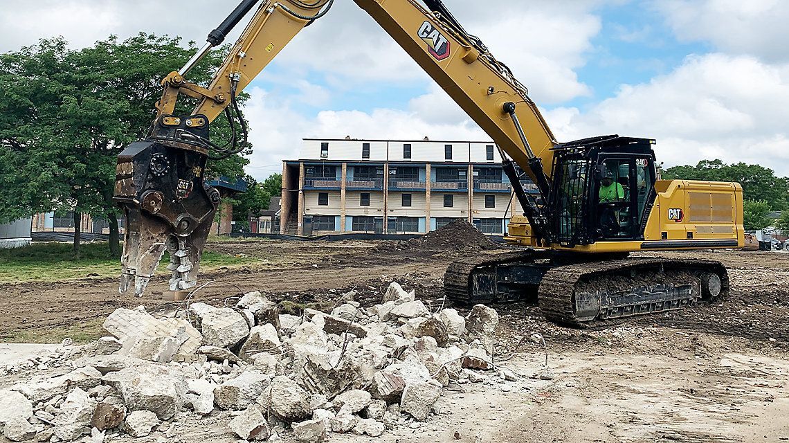 Excavator removing a foundation near Georgetown, TX.