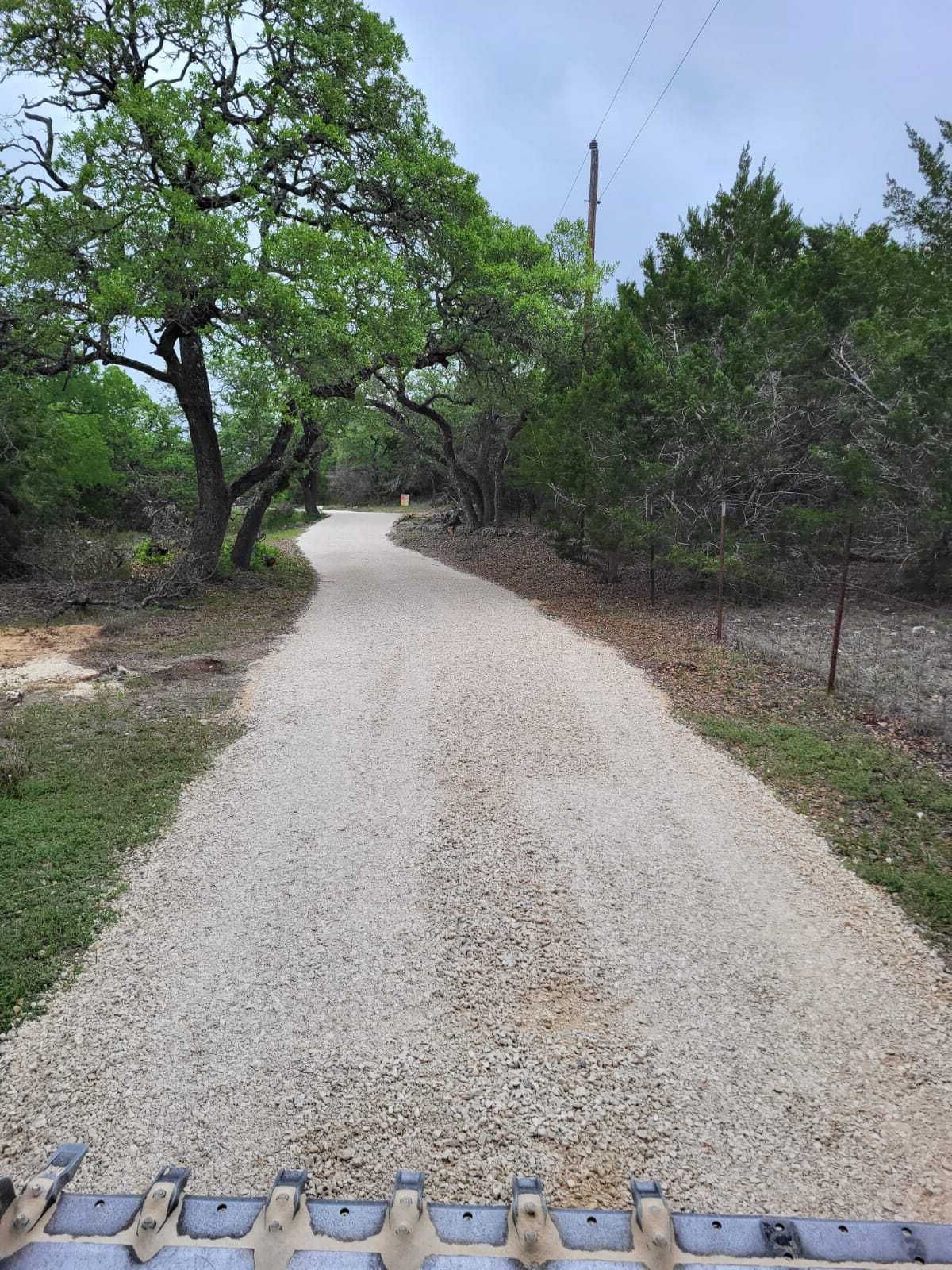 Installing a new gravel driveway and gravel grading near Pflugerville, TX.