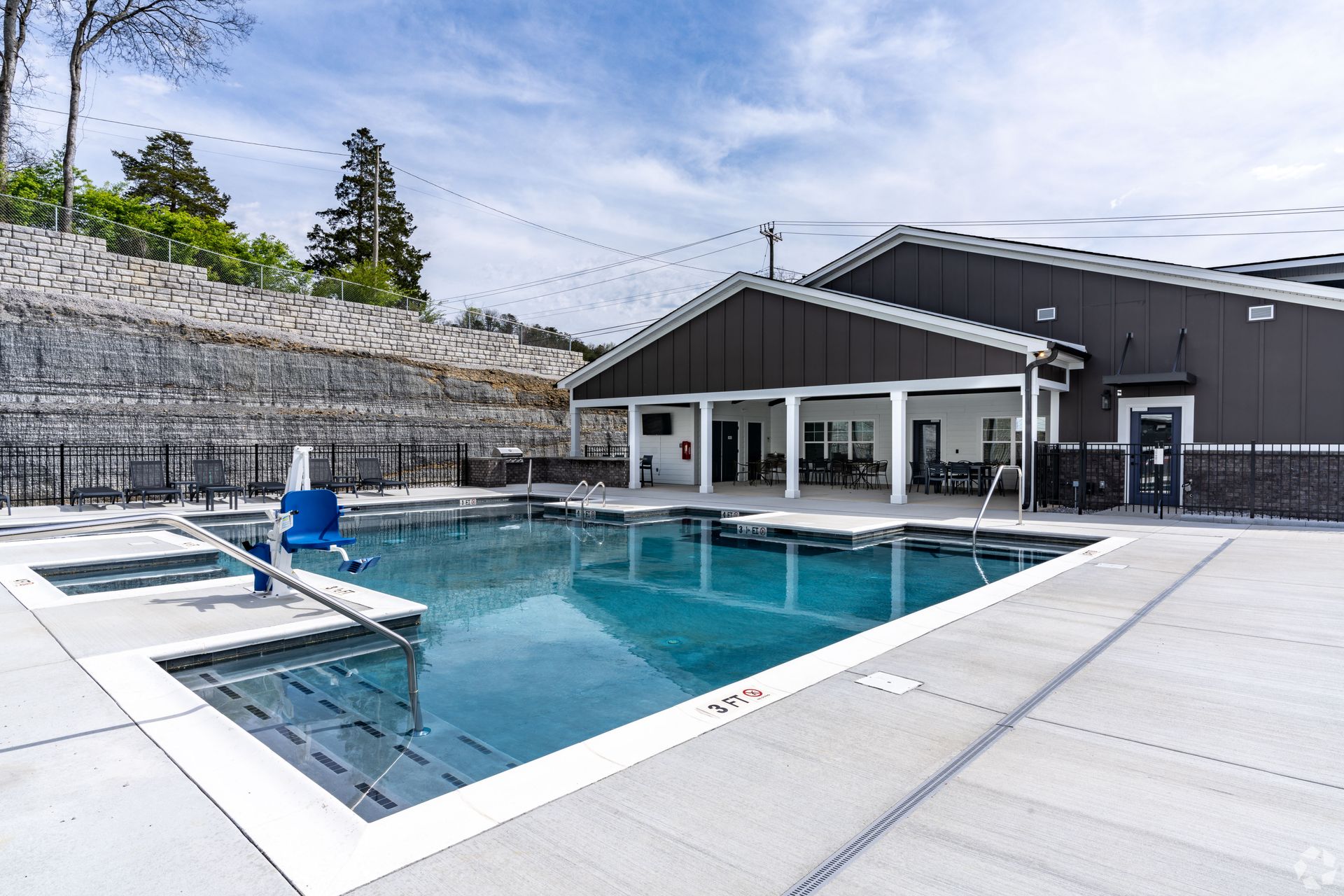 Resort-Style Swimming Pool with Sundeck for Lounging at The Indigo Apartments in Chattanooga, TN.