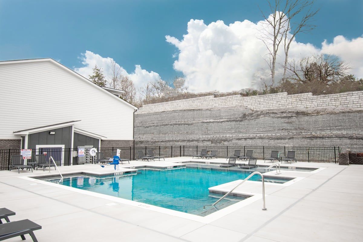 Resort-Style Swimming Pool with Sundeck for Lounging at The Indigo Apartments in Chattanooga, TN.