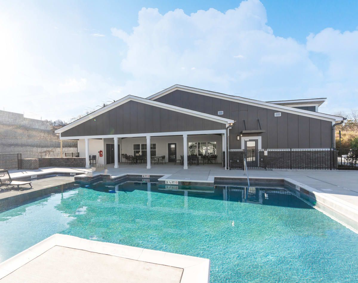 Resort-Style Swimming Pool with Sundeck for Lounging at The Indigo Apartments in Chattanooga, TN.