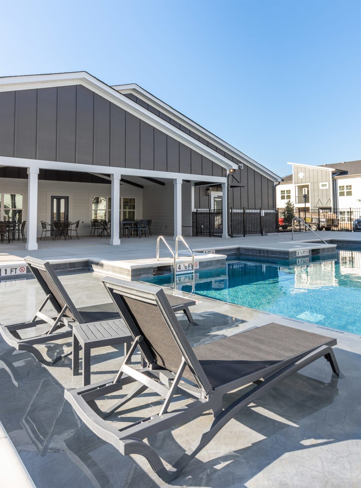 Resort-Style Swimming Pool with Sundeck for Lounging at The Indigo Apartments in Chattanooga, TN.