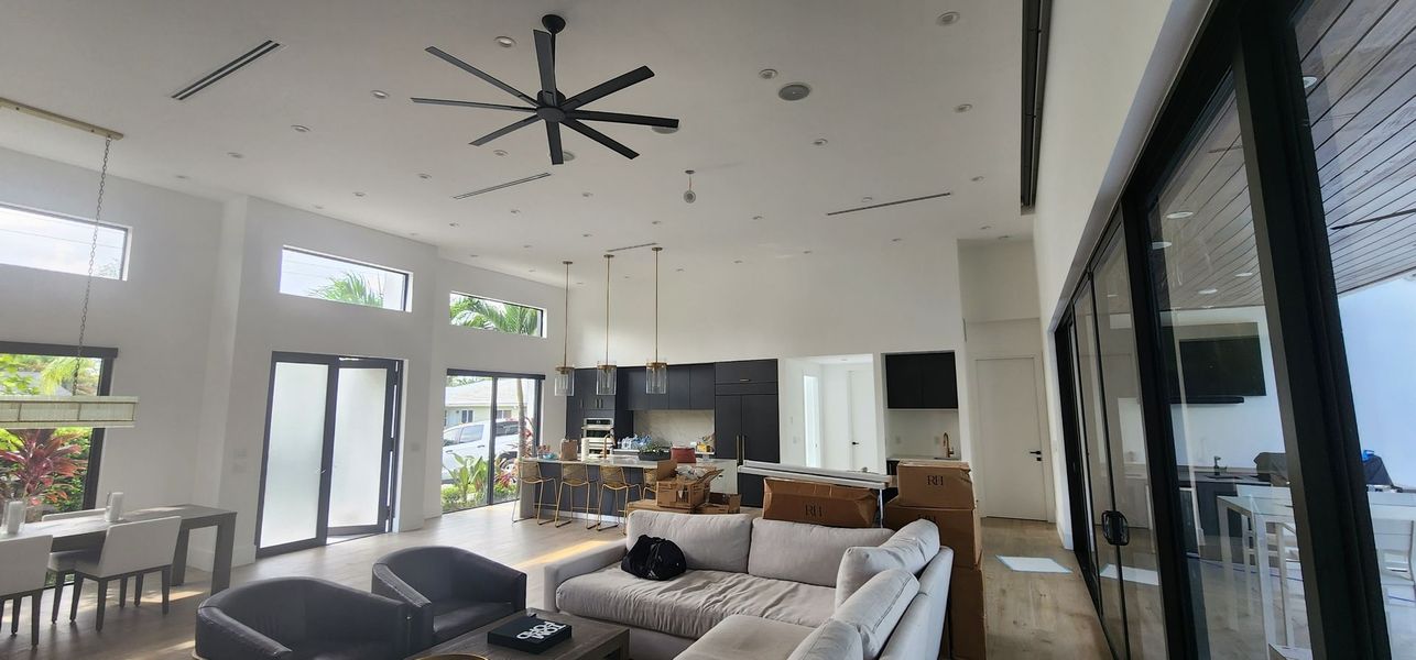 White walls and ceiling in an open-plan living room