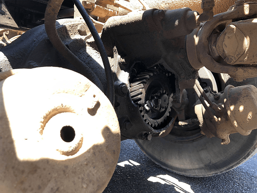 A close up of a motorcycle engine with a hole in it