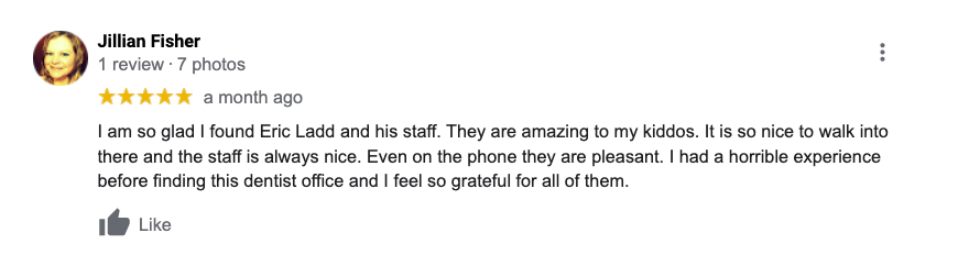A blurred image of a person 's review on a facebook page.