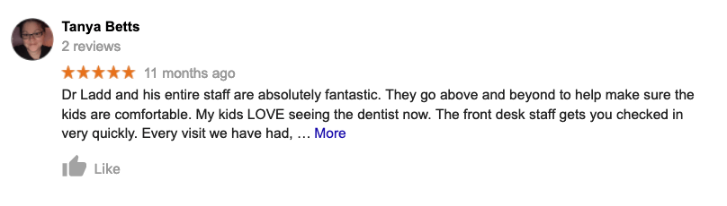 A blurred image of a google review for a dentist.