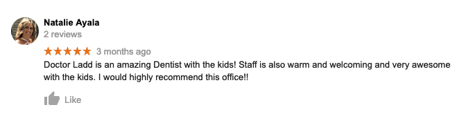 A blurred image of a facebook review for a dentist.