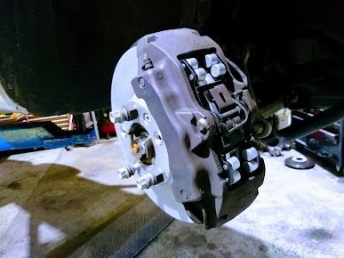 A Close Up Of A Brake Caliper On A Car — Albion Park Auto Electrical & Mechanical In Albion Park Rail, NSW