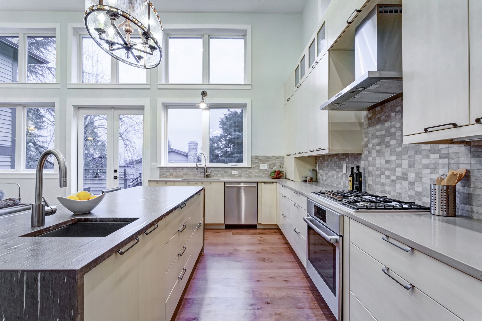 Modern alfresco kitchen with upscale appliances and granite island countertop.