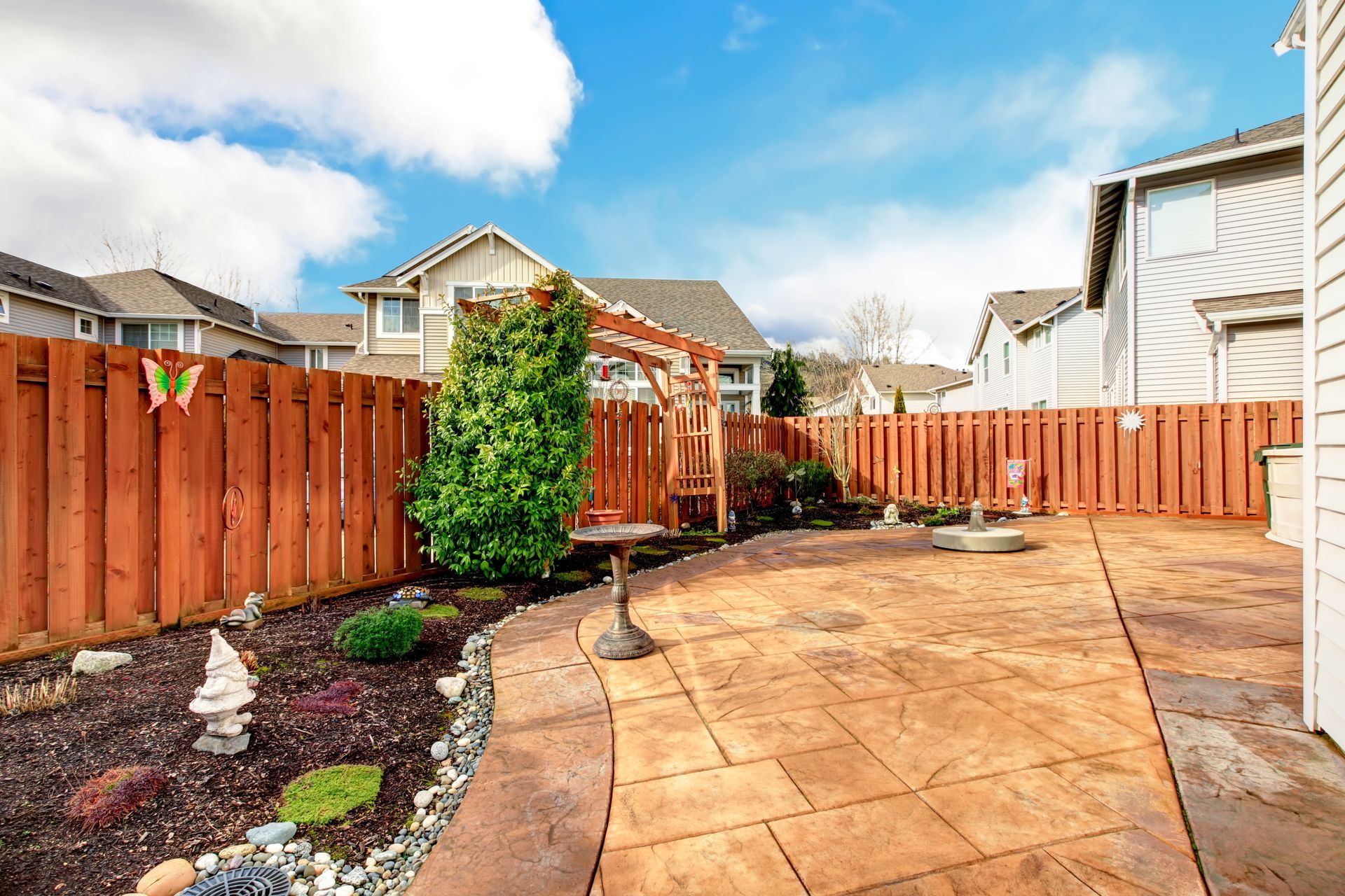 A backyard with a wooden fence