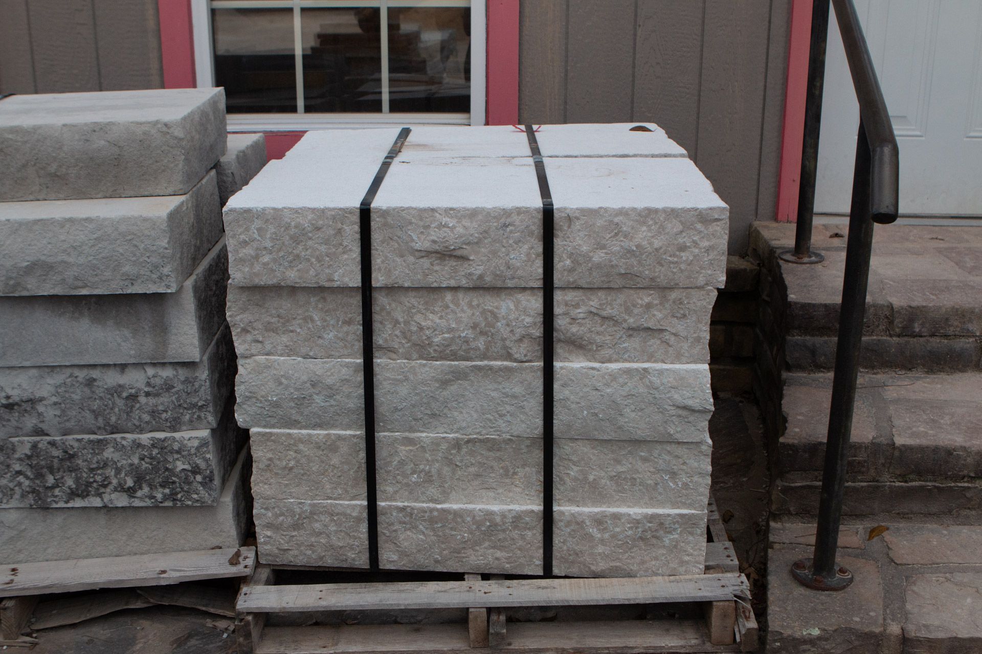A stack of concrete blocks on a wooden pallet