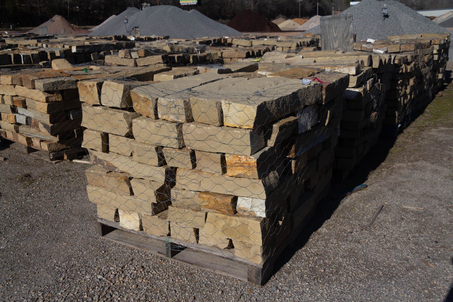 A pile of bricks sitting on top of a wooden pallet