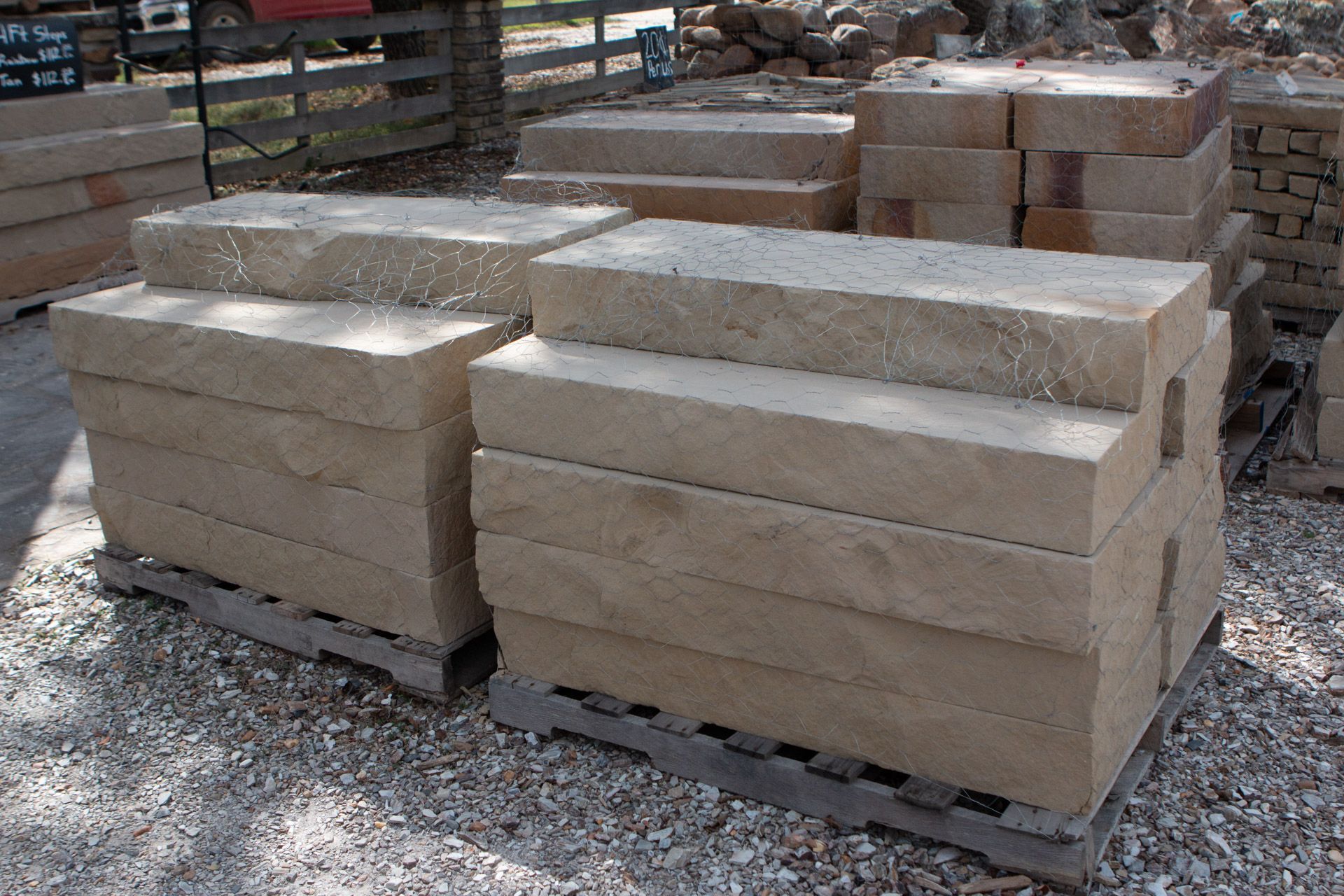 A pile of bricks stacked on top of each other on a wooden pallet