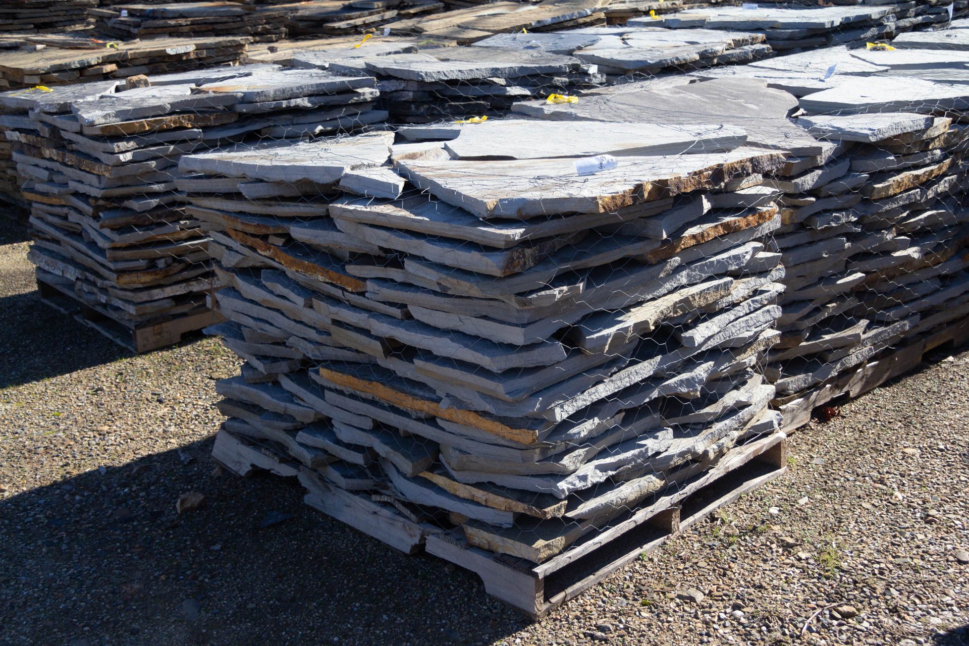 A pile of rocks stacked on top of each other on a wooden pallet.
