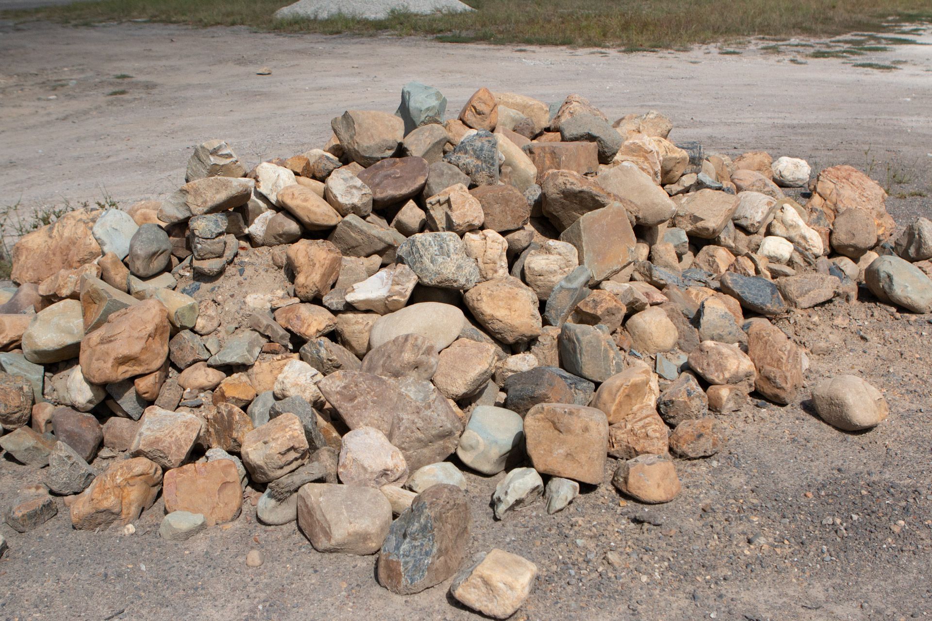 A pile of rocks is sitting on the ground