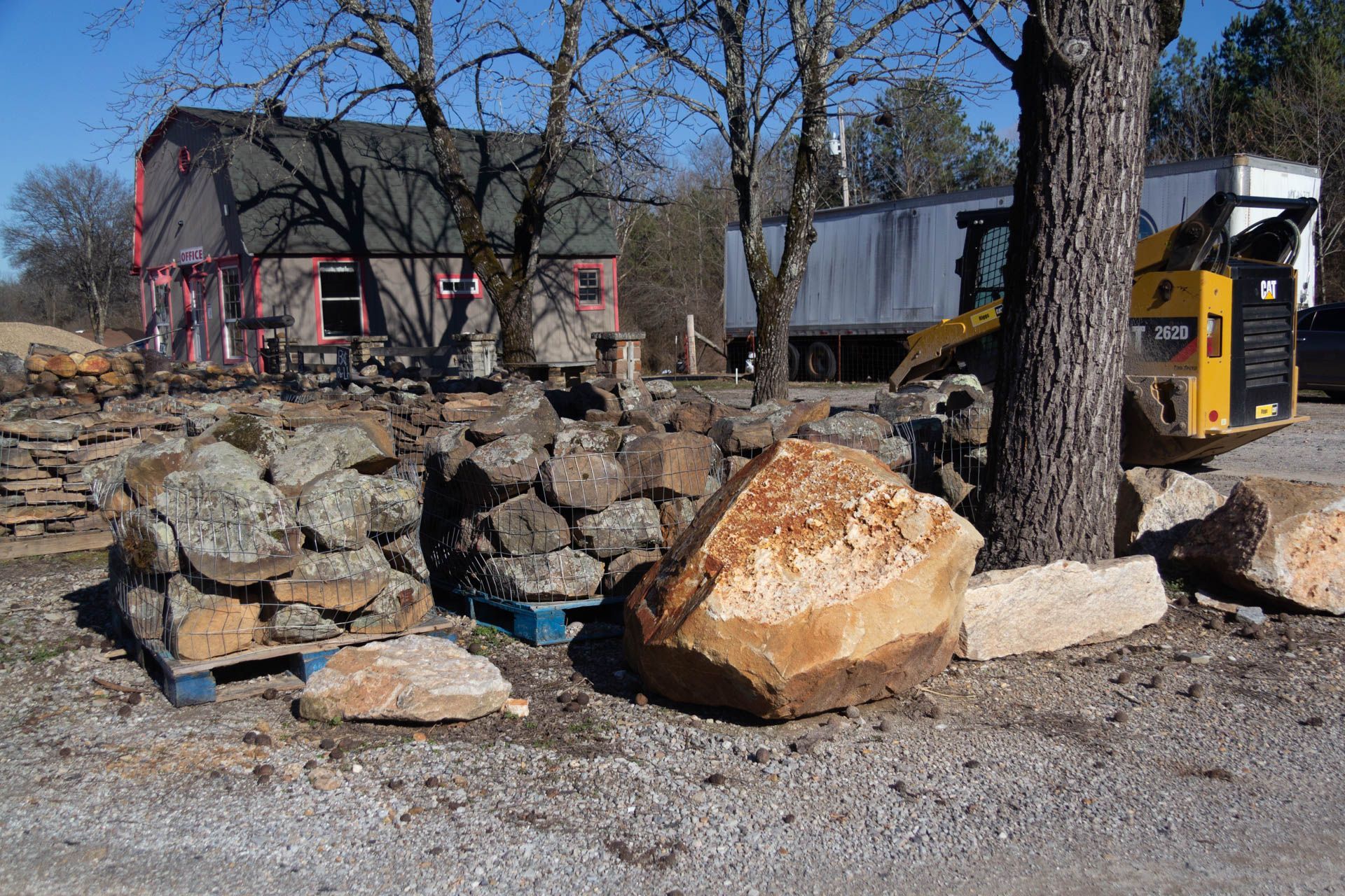 A pile of rocks is sitting in front of a building