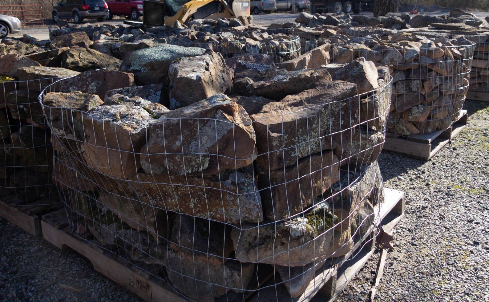 A pile of rocks is sitting on a wooden pallet