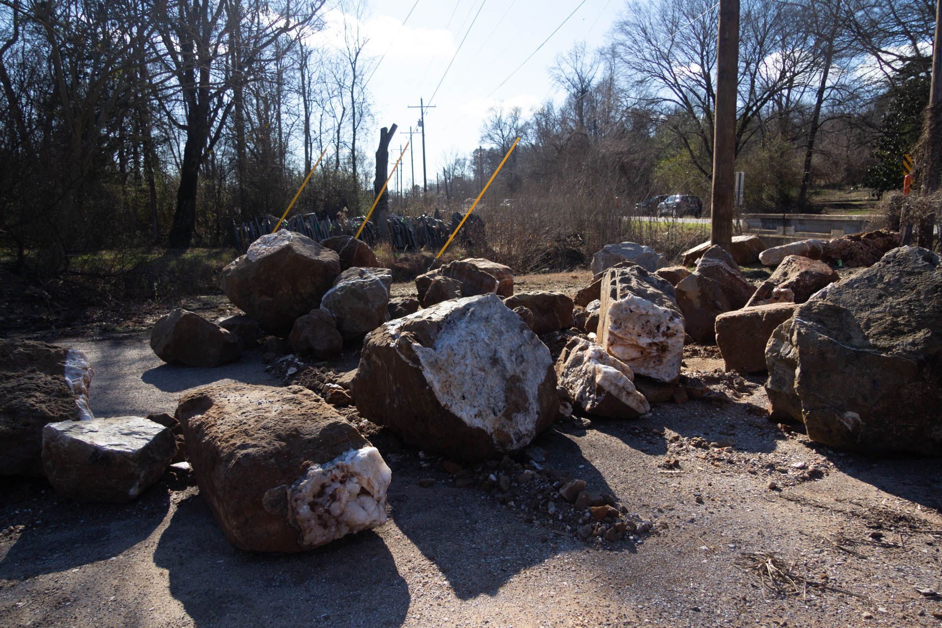 A pile of rocks on the side of a road