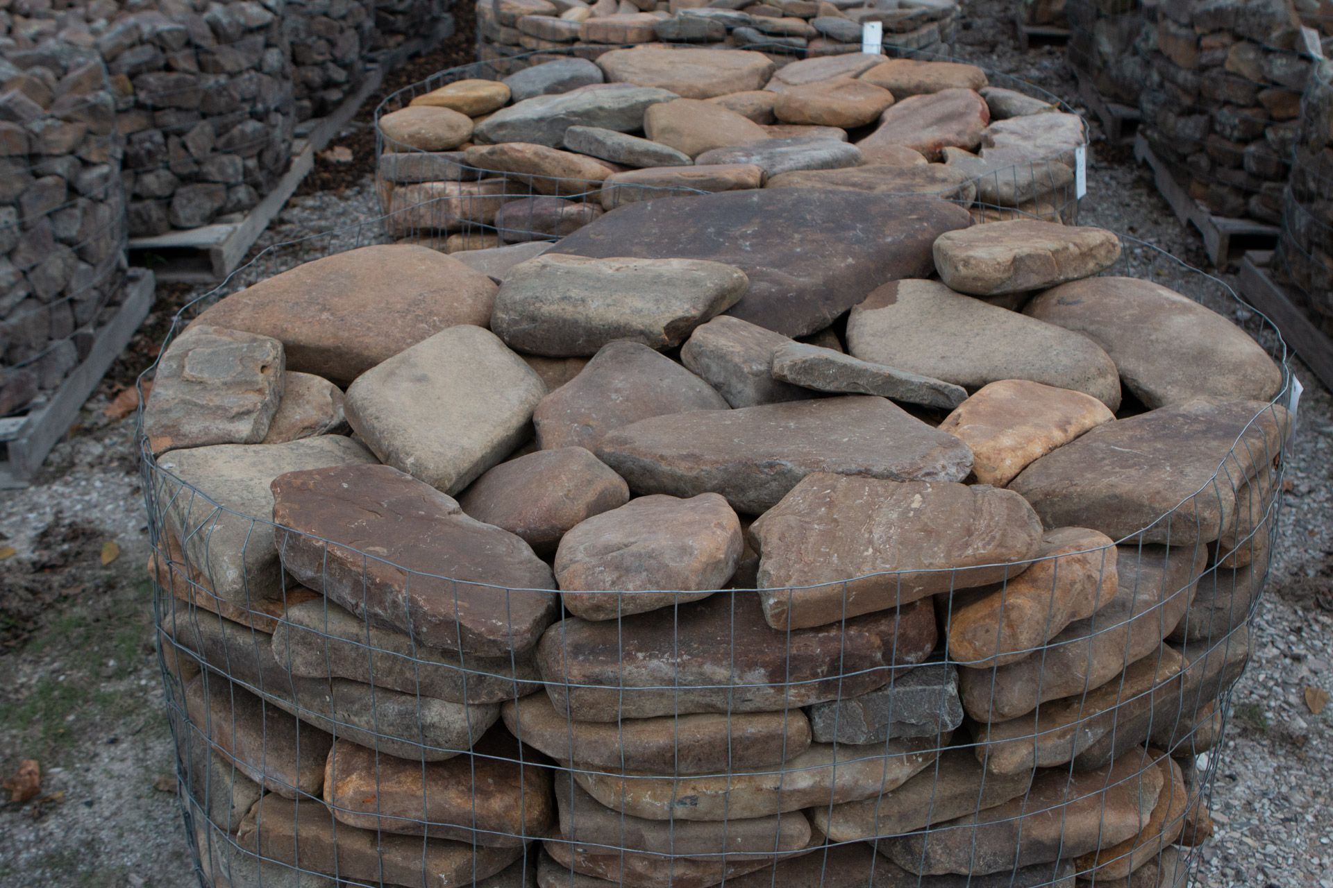 A pile of rocks is sitting on top of a pile of gravel.