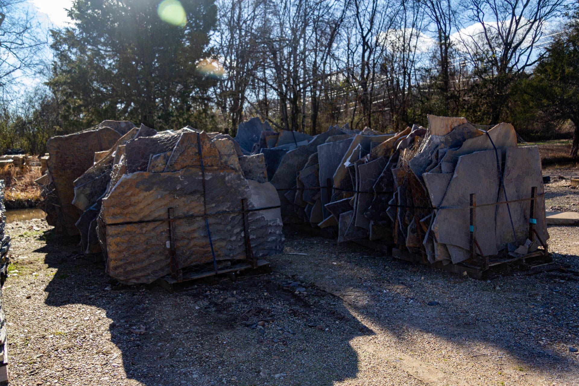 A pile of rocks is sitting on top of a gravel road.