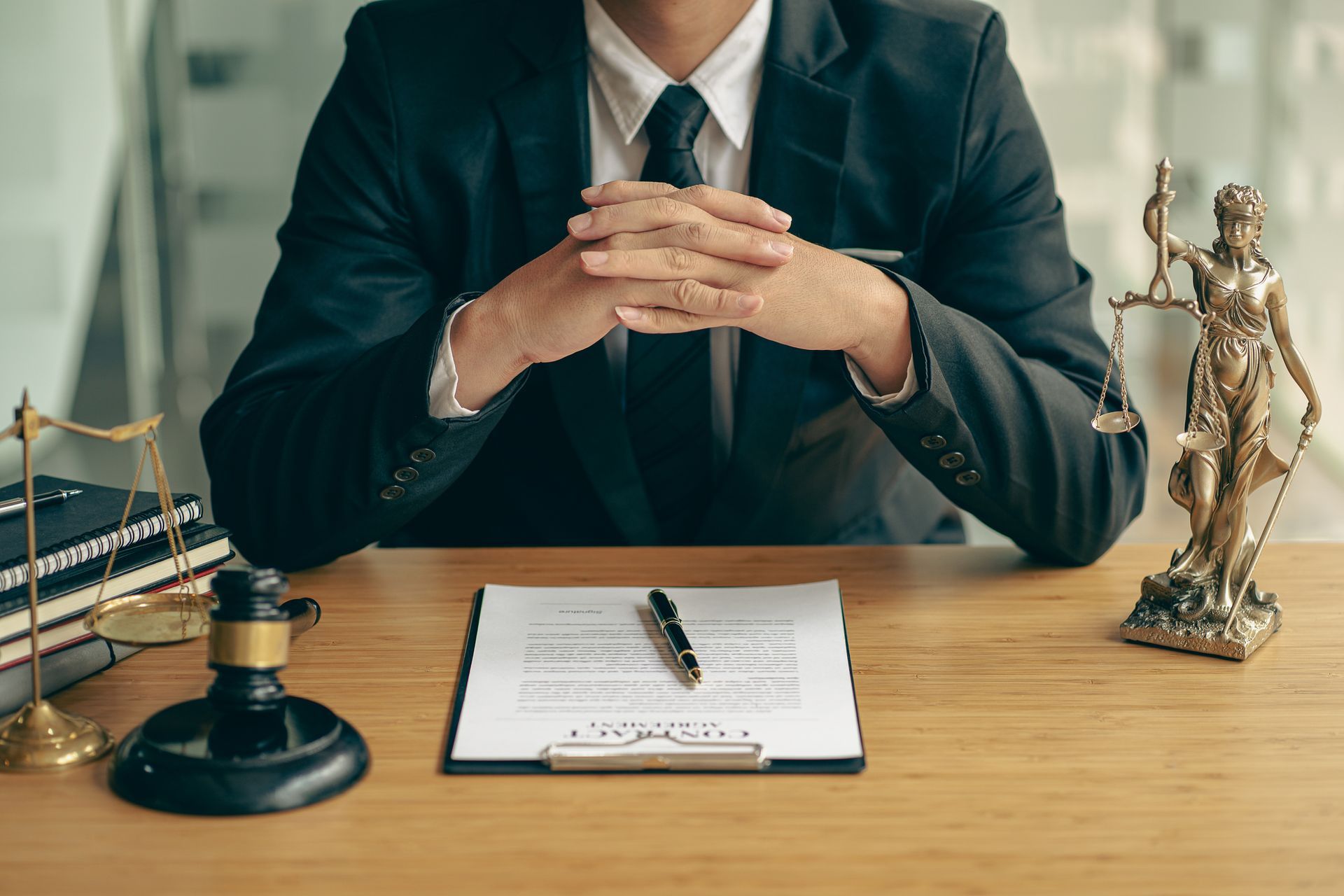 Attorney Sits at A Desk | Rockdale, NSW | Bonura Legal