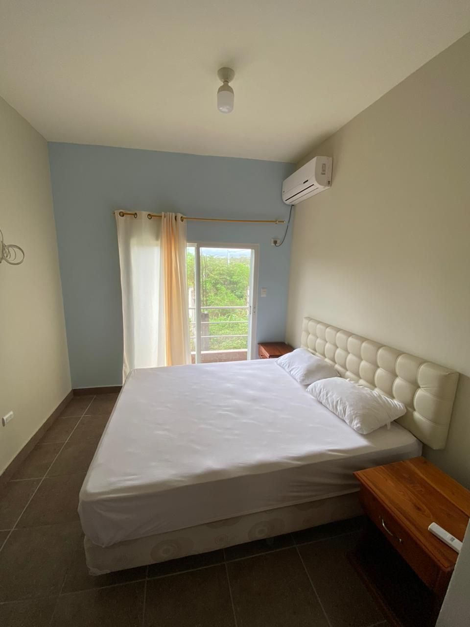 Private bedroom with air conditioning and balcony