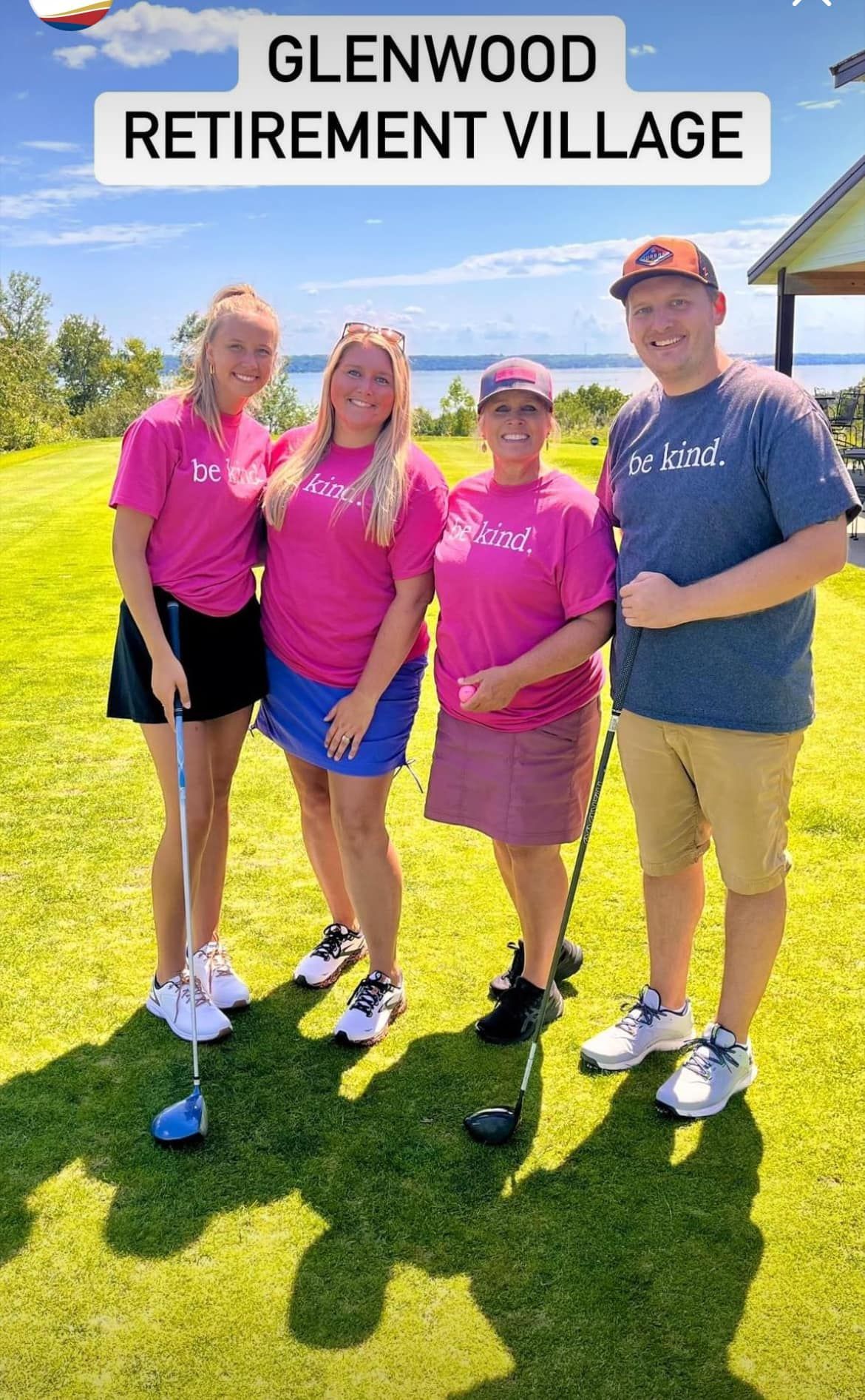 Four people stand on a grassy golf course, smiling at the camera, with the text 