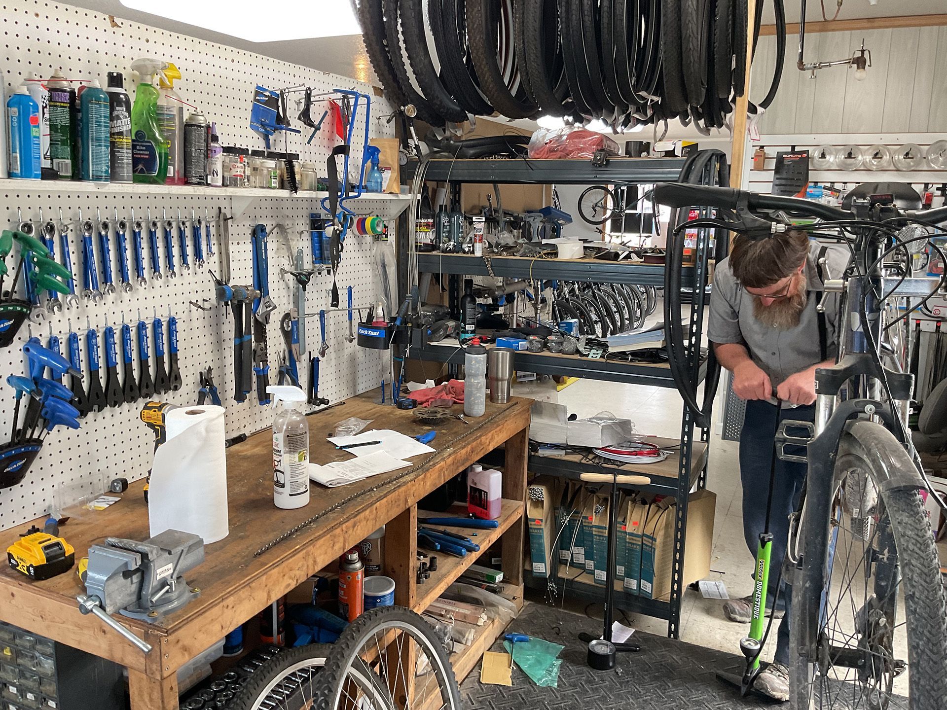 A man is working on a bicycle