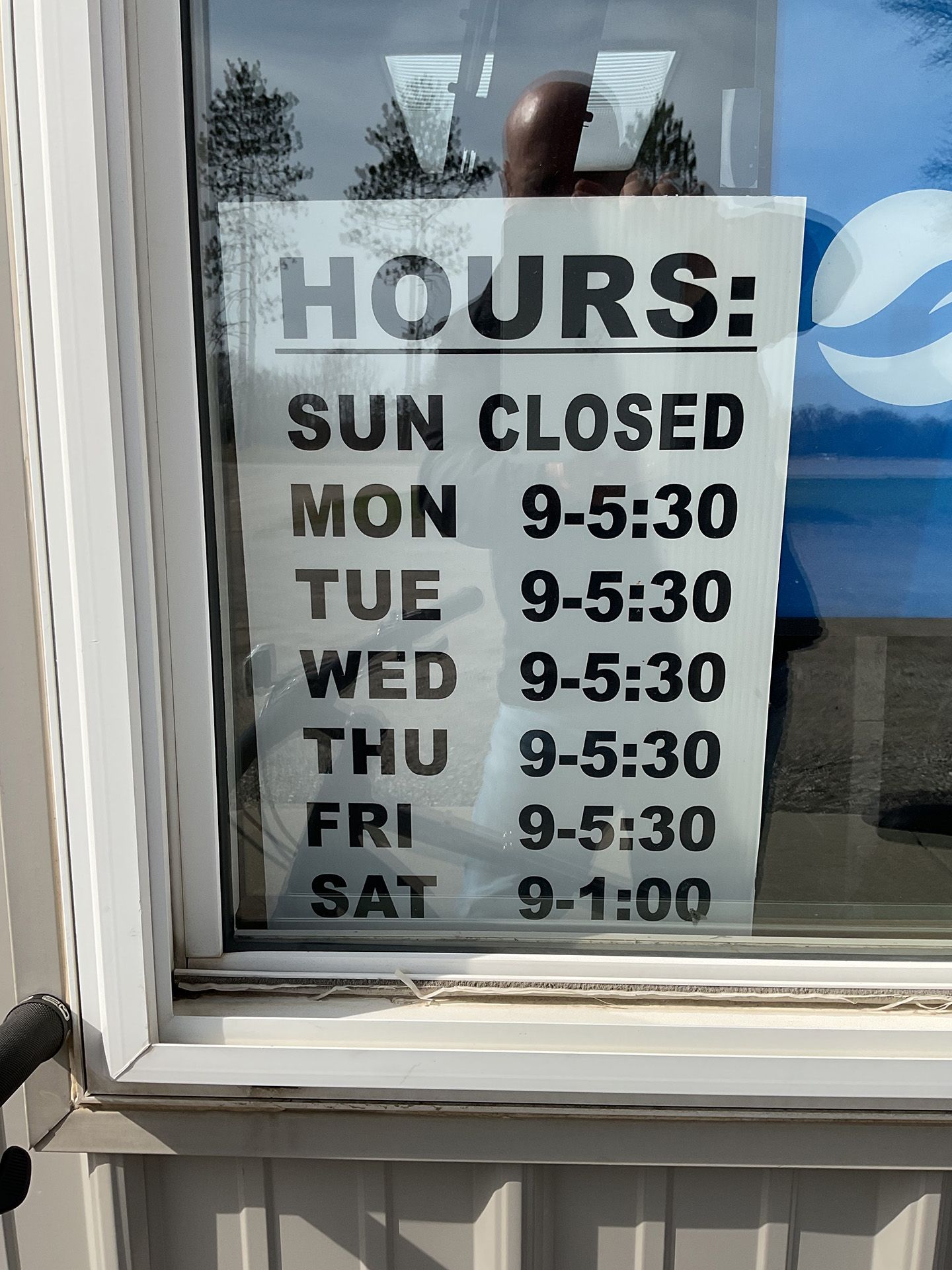 hours on the window glass