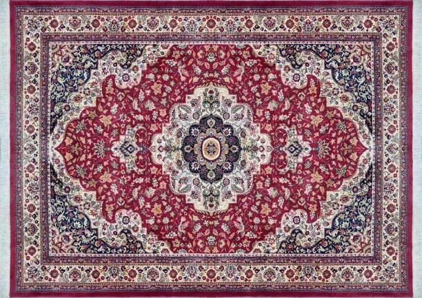 A red and white rug with a floral pattern on it.