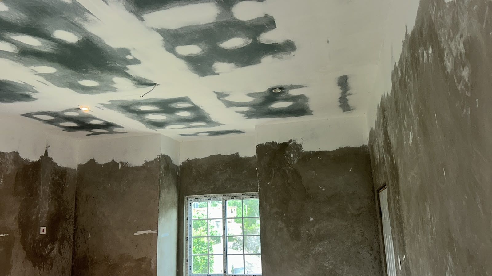 Ceiling and wall plastering in progress