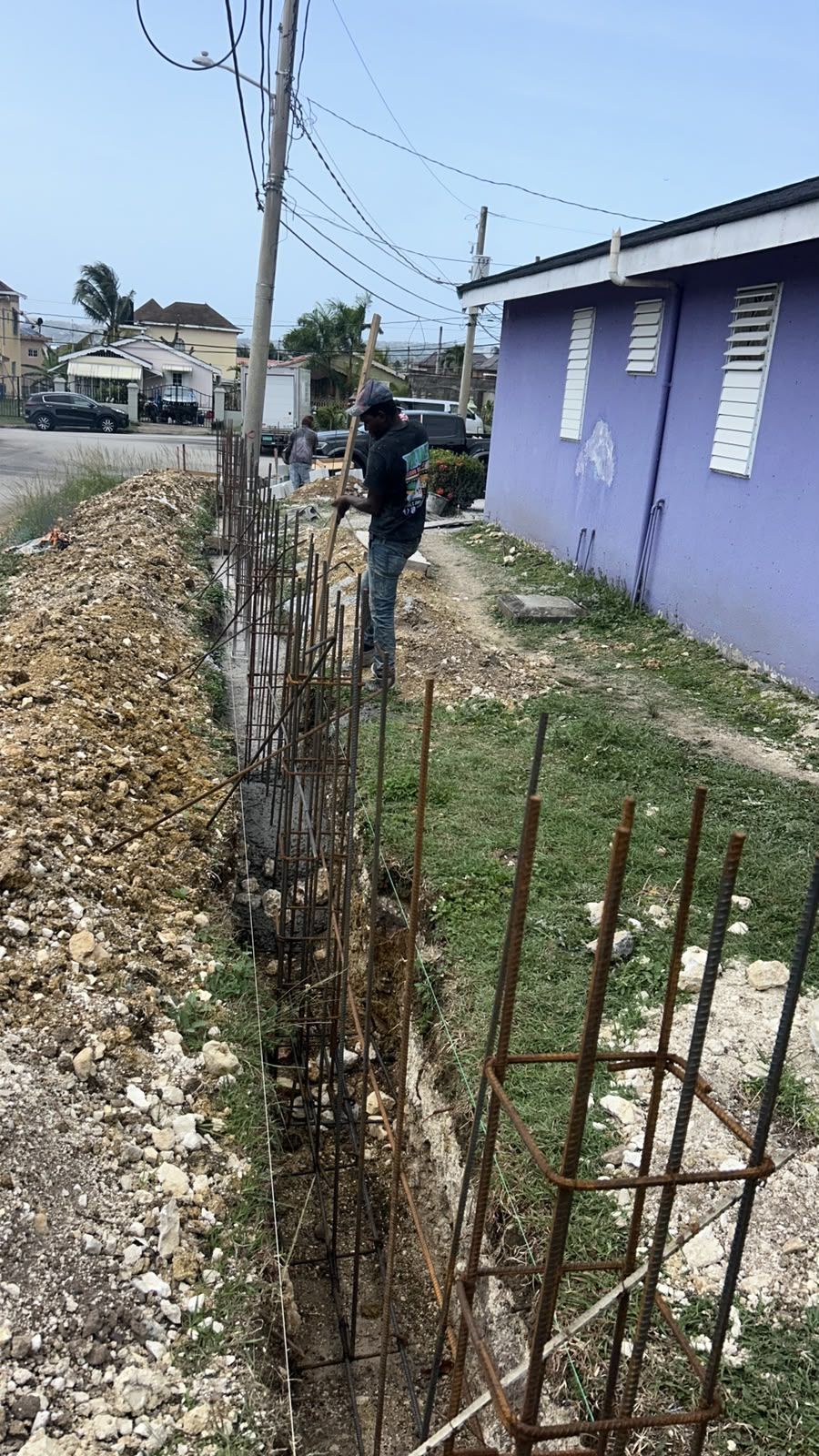 Perimeter wall footing with rebar along street
